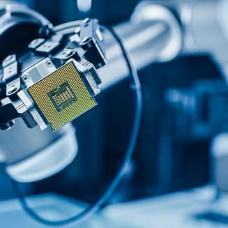robotic-arm-computer-processor-chip-golden-pins-blue-tech Robotic arm holding computer processor chip with golden pins, blue high-tech background blurred, precision gripping mechanism visible.